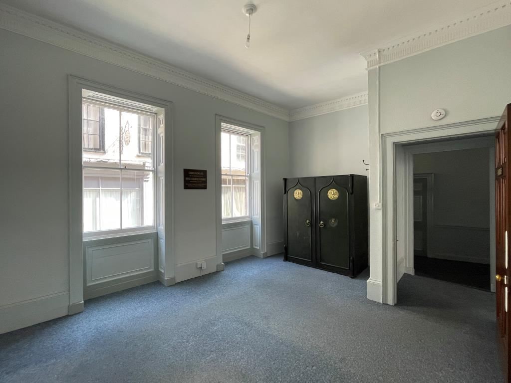Lot: 100 - PERIOD BUILDING WITH PERMISSION FOR CONVERSION INTO TWO HOUSES - Internal photo showing two windows